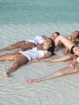 Six models sunbathe naked at the beach 00