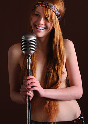 Nude Redhead Singing With Guitar